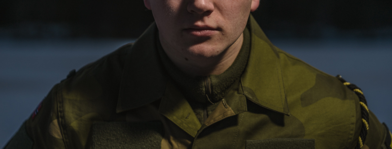 Banner of a solider wearing a Green Military uniform