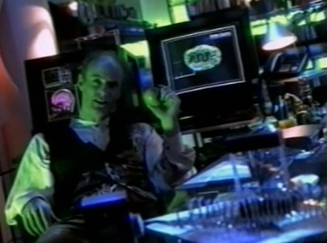 Screen shot of Dr. Tress in his lab surrounded by his machinery.