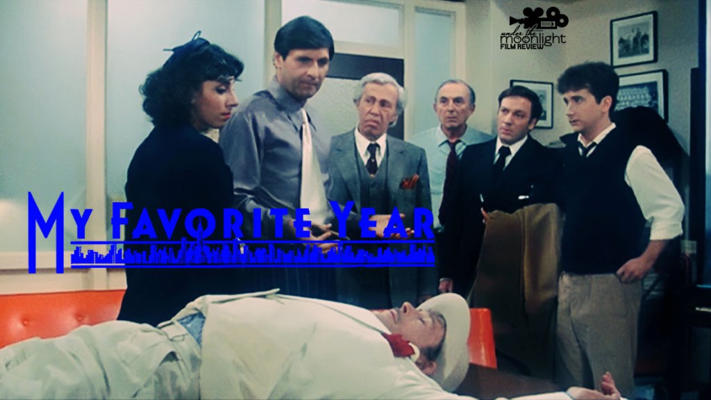 Man drunk on a table with people standing around.