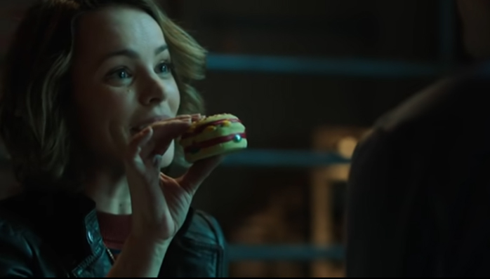 Screenshot of Annie giving Max a pet chew toy before she digs a bullet out of him.