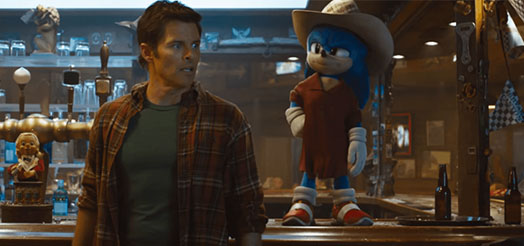  Tom and Sonic are in a bar with Sonic dressed up incognito in a big beige hat and a large brown shirt.