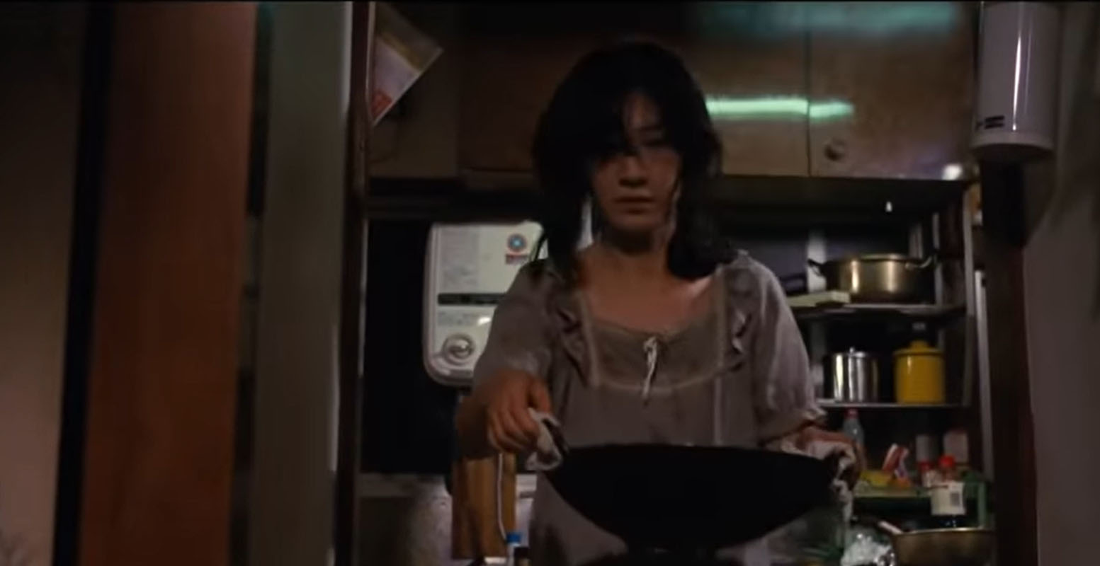 Woman with prepared dinner from kitchen