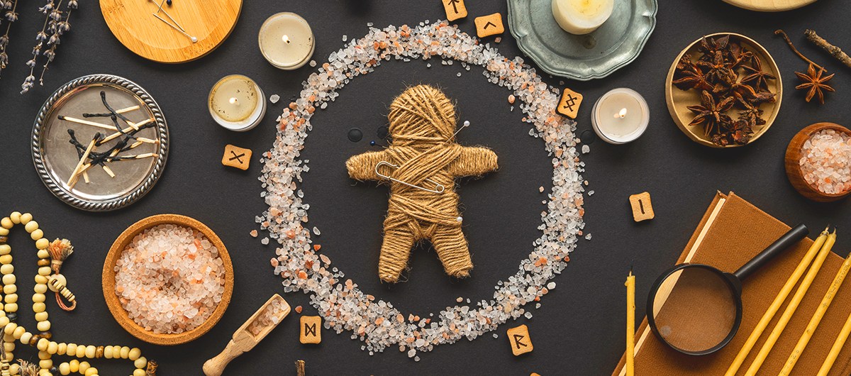 banner - voodoo doll on a table