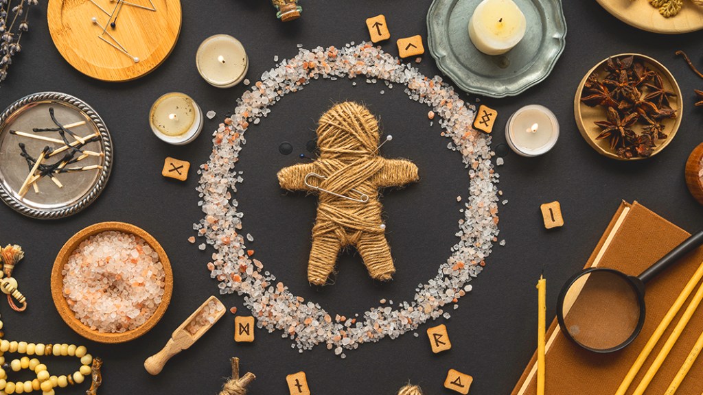 banner - voodoo doll on a table